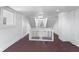 Upper level hallway with white railing and access to multiple rooms at 249 N Beville Ave, Indianapolis, IN 46201