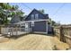 Blue house with a deck and a partially fenced yard at 249 N Beville Ave, Indianapolis, IN 46201