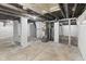 Unfinished basement area with water heater and exposed utilities at 249 N Beville Ave, Indianapolis, IN 46201