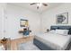 Bright bedroom with built-in desk and full bed at 249 N Beville Ave, Indianapolis, IN 46201