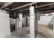 Unfinished basement with water heater and exposed utilities at 249 N Beville Ave, Indianapolis, IN 46201