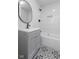 Bathroom with tub, vanity, and patterned floor at 249 N Beville Ave, Indianapolis, IN 46201