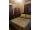 Large bedroom with a queen-size bed and wooden storage cabinet at 2220 S Burke St, Indianapolis, IN 46231