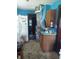 Kitchen with refrigerator and wood cabinets at 2220 S Burke St, Indianapolis, IN 46231