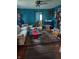 Living room features hardwood floors and a white couch at 2220 S Burke St, Indianapolis, IN 46231