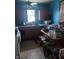 Kitchen with wood cabinets, appliances, and linoleum floor at 2220 S Burke St, Indianapolis, IN 46231