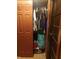Closet with hanging clothes and shelving at 2220 S Burke St, Indianapolis, IN 46231