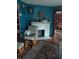 Living room with rocking chair, fireplace, and hardwood floors at 2220 S Burke St, Indianapolis, IN 46231