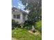 Side view of a small house with a fountain and yard art at 2220 S Burke St, Indianapolis, IN 46231