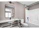 Modern bathroom with white fixtures and a sleek black vanity at 322 N Summit St, Indianapolis, IN 46201