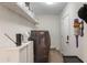 Bright laundry room with washer, dryer, and ample shelving at 1134 St Peter St, Indianapolis, IN 46203