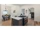 Open concept kitchen with island, dining area, and stainless steel appliances at 1134 St Peter St, Indianapolis, IN 46203