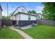 House back view, showcasing a patio and well-maintained lawn at 1134 St Peter St, Indianapolis, IN 46203
