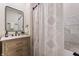 Clean bathroom with a vanity, shower, and marble tile at 1134 St Peter St, Indianapolis, IN 46203