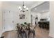 Charming dining area with a round table and four chairs, adjacent to the kitchen at 1134 St Peter St, Indianapolis, IN 46203