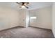 Simple bedroom with gray carpet, a closet and a ceiling fan at 1134 St Peter St, Indianapolis, IN 46203
