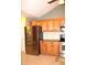 Modern kitchen with stainless steel appliances and oak cabinets at 2148 Heather Glen Way, Franklin, IN 46131