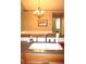Kitchen with double sink, updated faucet, and granite countertops at 2148 Heather Glen Way, Franklin, IN 46131