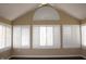 Bright sunroom featuring an arched window and white plantation shutters at 2148 Heather Glen Way, Franklin, IN 46131