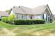 Stone and siding home with manicured hedges at 2148 Heather Glen Way, Franklin, IN 46131