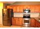 Stainless steel appliances and oak cabinets in this updated kitchen at 2148 Heather Glen Way, Franklin, IN 46131