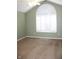 Spacious bedroom with neutral walls and large arched window at 2148 Heather Glen Way, Franklin, IN 46131