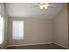 Simple bedroom with carpet, neutral walls, plantation shutters, and ceiling fan at 2148 Heather Glen Way, Franklin, IN 46131
