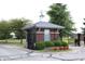 Private gated community entrance with brick guardhouse and landscaping at 2148 Heather Glen Way, Franklin, IN 46131