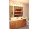 Bathroom with wood vanity, large mirror, and shower/tub combo at 2148 Heather Glen Way, Franklin, IN 46131