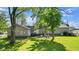 Backyard with patio furniture and green lawn at 11445 N School St, Fishers, IN 46038
