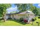 Side view of house showcasing yard and garden at 11445 N School St, Fishers, IN 46038