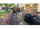 Private patio with brick wall, a great space for grilling at 7433 Prairie Lake Dr, Indianapolis, IN 46256