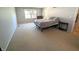Spacious bedroom with neutral walls and plush carpeting at 7433 Prairie Lake Dr, Indianapolis, IN 46256