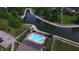 Community pool with plenty of lounge chairs and landscaping at 7433 Prairie Lake Dr, Indianapolis, IN 46256