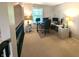 Home office with window, carpeted floors and two work stations at 7433 Prairie Lake Dr, Indianapolis, IN 46256