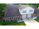 Two-story home with double garage and landscaped yard at 7433 Prairie Lake Dr, Indianapolis, IN 46256