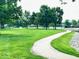 Serene community with lush green spaces and a walking trail at 7433 Prairie Lake Dr, Indianapolis, IN 46256