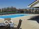 Community pool with lounge chairs and patio furniture at 7433 Prairie Lake Dr, Indianapolis, IN 46256