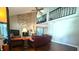 Spacious living room with hardwood floors and stone fireplace at 7433 Prairie Lake Dr, Indianapolis, IN 46256