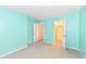 Light teal bedroom with grey carpet and closet at 3441 Hickory E Ln, Indianapolis, IN 46214