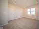 Well-lit bedroom featuring a large window and carpeted floors at 8840 Faulkner Dr, Indianapolis, IN 46239