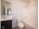 Clean bathroom with tub, toilet and dark vanity at 8840 Faulkner Dr, Indianapolis, IN 46239