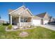 Brick ranch home with covered porch and landscaped yard at 8840 Faulkner Dr, Indianapolis, IN 46239