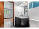 Clean bathroom with dark vanity and slate floor at 9996 N County Road 200 W, Muncie, IN 47302