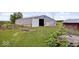 Large metal barn with open bay doors and a star at 9996 N County Road 200 W, Muncie, IN 47302