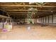 Large barn interior with hay flooring and wooden stalls at 9996 N County Road 200 W, Muncie, IN 47302