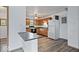 Kitchen with oak cabinets, green countertops, and a breakfast bar at 9996 N County Road 200 W, Muncie, IN 47302