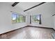 Living room with hardwood floors and large windows at 9996 N County Road 200 W, Muncie, IN 47302