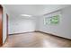 Spacious bedroom with hardwood floors and large window at 9996 N County Road 200 W, Muncie, IN 47302