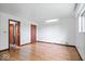 Hardwood floor bedroom with access to bathroom and closets at 9996 N County Road 200 W, Muncie, IN 47302